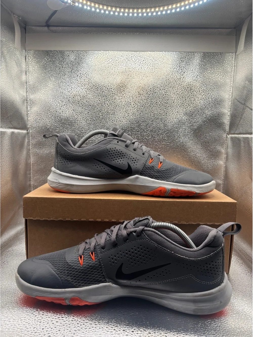 Nike legend trainer orange accents